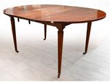 an image of a dining table with a leaf shaped top