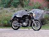 a black motorcycle parked on the side of the road