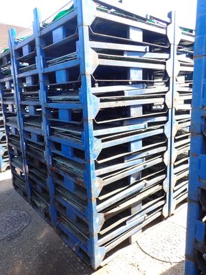 a lot of pallets that are stacked up together