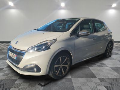 a white car is parked in a room with a checkered floor