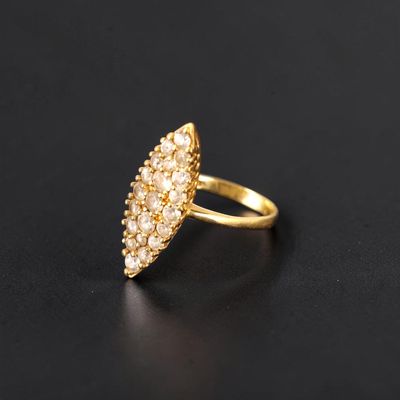 a gold plated ring with a cluster of white diamonds