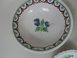 a bowl and a bowl with a flower design on it