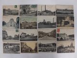 an old photo of a bunch of old postcards on a table
