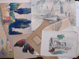 a pile of drawings on a table next to a laptop