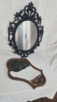 a mirror that is sitting on a table next to a mirror