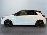 the white car is parked in a large room with a white wall