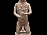 an image of a statue of a man holding a baby in his arms