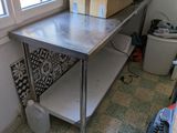 an image of a kitchen area with a table and a window