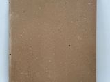 an empty piece of cardboard sitting on top of a white surface