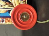 a close up of a red object on a table