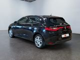 the rear end of a black car in a showroom