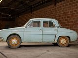a old car that is parked in a garage