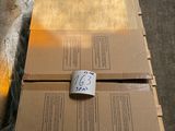 a cardboard box sitting on top of a pallet on the floor