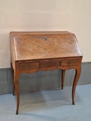 a small wooden desk with a drawer on top of it