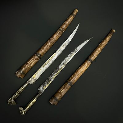 three different types of knives on a table with a black background