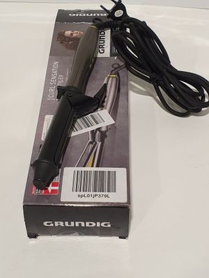 a box with a hair dryer and a cord on it