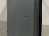 a metal cabinet with a door open on the floor