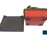 an image of a red suitcase sitting next to a black box