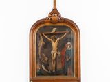 an old wooden crucifix hanging on a wall in a room