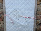 a picture of a mattress with a tape on it