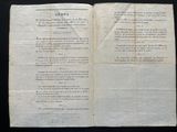 an old book opened to a page with a poem written on it