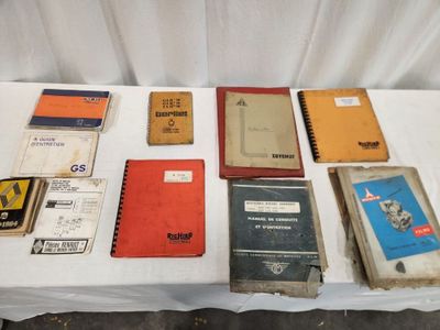 many books on a table with a white table cloth