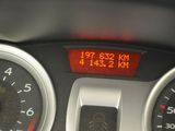 a close up of a speedometer on a car dashboard