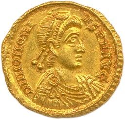 une pièce d'or à l'effigie d'un homme portant une coiffe