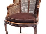 an image of a chair with a brown cushion on it