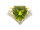 an image of a ring with a peridot and diamonds