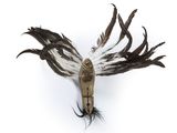 a bird that is hanging on a hook on the wall