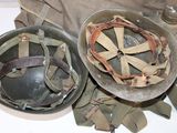 two helmets sitting on a table next to each other
