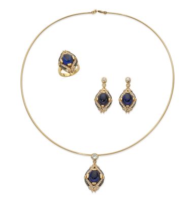 a gold necklace and earrings set with sapphire stones