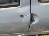 a car that has a broken door handle and a hole in the side of the door