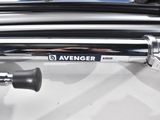 a close up of a motorcycle handlebar with a sticker on it