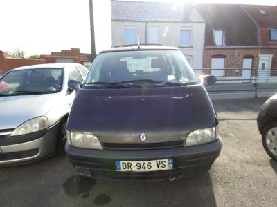 two cars parked next to each other in a parking lot