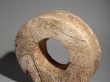sculpture of a stone donut with a hole in the middle of it