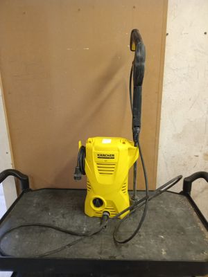 a yellow pressurer sitting on top of a black cart