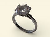 a close up of a diamond ring on a white surface
