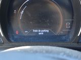a close up of a car ' s dashboard with a speedometer