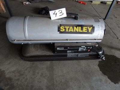 an image of a gas tank with a sign on it
