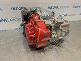 an image of a red engine sitting on top of a floor