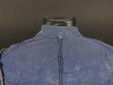 denim jacket with leather trims and buttons on a mannequin mannequin mannequin mannequin mannequin mannequin mannequin mann