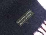 a close up of a scarf with a label on it