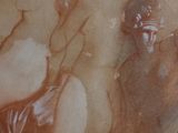 a picture of a painting of a woman on a table