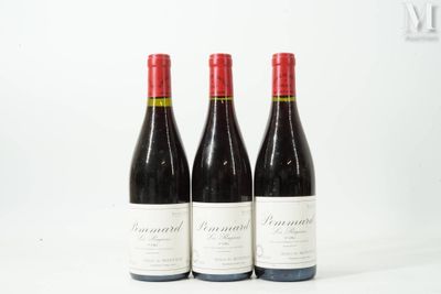 three bottles of red wine sitting on top of a white table