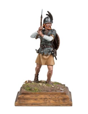 a figurine of a roman soldier with a sword and shield