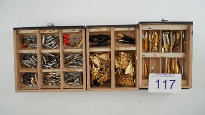 a wooden box with many different types of screws in it