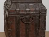 a wooden trunk sitting on top of a table