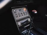 a car dashboard with a clock and a radio in it